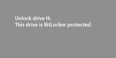 A screen shot of a notification that is displayed when you connect an encrypted drive. You can tap or click the notification to open the BitLocker dialog box.