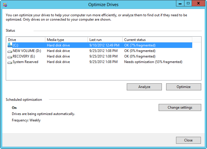 A screen of the Optimize Drives dialog box, showing volume status and management options.